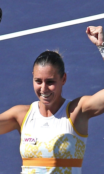 Pennetta routs injured Radwanska to win Indian Wells title